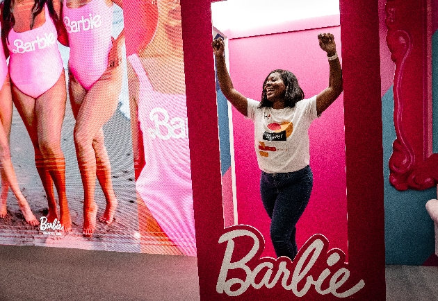 lady standing inside licensed barbie box