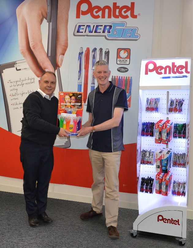 Man being presented prize at trade show stand