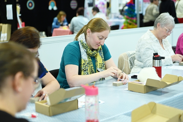 lady sat at table crafting