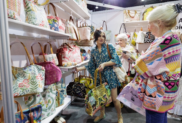 stand with fabric bags at a trade show