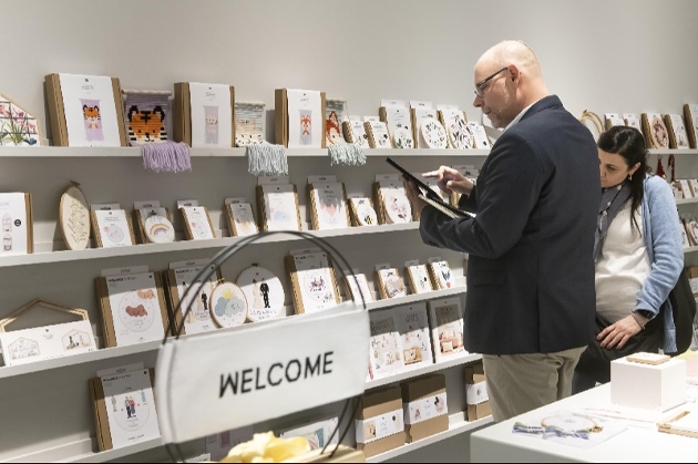 man taking notes at a trade show