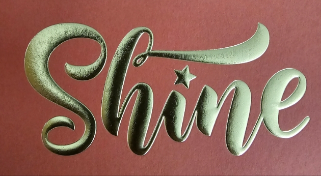 metallic lettering spelling out the word - shine