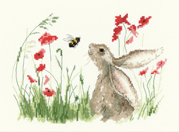 cross stitch kit of rabbit sniffing a bee among flowers